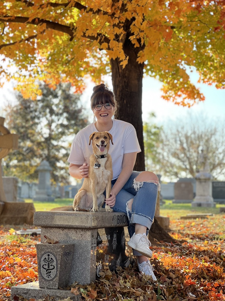 Christa Wanamaker, Licensed Professional Counselor, smiling outdoors with her dog